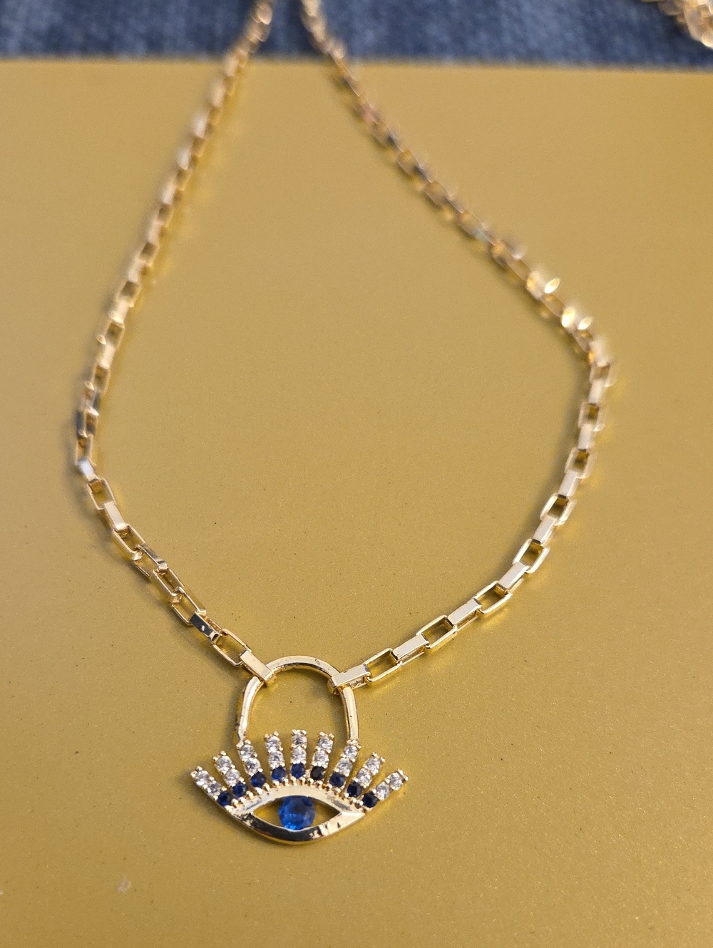 Gold Evil Eye Pendant Necklace with Blue Accent